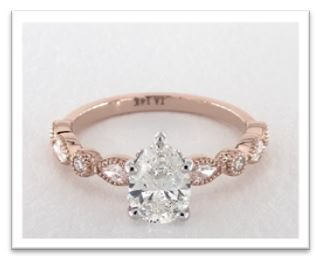rose gold pear cut engagement ring 